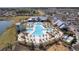 Stunning aerial view of an expansive community pool with palm trees and plenty of lounge seating at 181 Ashworth Dr, Summerville, SC 29486