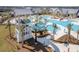 Resort-style pool with waterslide, surrounded by palm trees and ample lounging space at 181 Ashworth Dr, Summerville, SC 29486