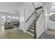 Bright, open staircase with white railings and wood accents, leading to a spacious living area with natural light at 181 Ashworth Dr, Summerville, SC 29486
