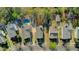 An aerial view showcasing the houses and their yards, including a pool, in an orderly suburban neighborhood at 1844 Hubbell Dr, Mount Pleasant, SC 29466