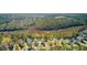 Aerial view of neighborhood, showcasing homes near forest and marshy wetlands at 1844 Hubbell Dr, Mount Pleasant, SC 29466