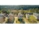 Aerial view of homes with yards and driveways, nestled amongst trees and offering a glimpse of the surrounding landscape at 1844 Hubbell Dr, Mount Pleasant, SC 29466