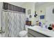 Bathroom featuring shower with curtain, toilet and sink with mirror at 1844 Hubbell Dr, Mount Pleasant, SC 29466