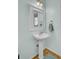 The bathroom features a classic pedestal sink, framed mirror, and stylish fixtures for a clean aesthetic at 1844 Hubbell Dr, Mount Pleasant, SC 29466