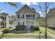 Charming two-story home with a front porch and a well-maintained landscaped yard at 1844 Hubbell Dr, Mount Pleasant, SC 29466