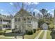 Charming two-story home with a front porch and a well-maintained landscaped yard at 1844 Hubbell Dr, Mount Pleasant, SC 29466