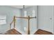 Hallway features wood banister, white trim, and abundant natural light, creating an inviting atmosphere at 1844 Hubbell Dr, Mount Pleasant, SC 29466