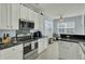 Kitchen showcases stainless steel appliances, white cabinetry and modern backsplash, perfect for cooking at 1844 Hubbell Dr, Mount Pleasant, SC 29466