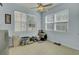 Bright sun room has natural light with multiple windows and a ceiling fan, perfect for pets at 1844 Hubbell Dr, Mount Pleasant, SC 29466