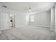 Large bedroom offers neutral carpet and paint, a ceiling fan, and two closets for ample storage at 190 Steepbrook, Summerville, SC 29486
