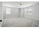 Spacious bedroom with neutral carpet, a ceiling fan, and two windows that let in plenty of natural light at 190 Steepbrook, Summerville, SC 29486