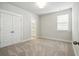Bright bedroom with a double door closet and a window allowing ample natural light at 190 Steepbrook, Summerville, SC 29486