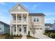 Charming two-story home with a welcoming front porch and manicured landscaping showcasing curb appeal at 190 Steepbrook, Summerville, SC 29486