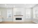 Bright living room featuring a modern fireplace, hardwood floors, and natural light, creating a cozy atmosphere at 190 Steepbrook, Summerville, SC 29486