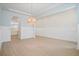 Spacious living room with hardwood floors and decorative lighting fixture, perfect for entertaining guests or relaxing at 190 Steepbrook, Summerville, SC 29486
