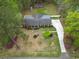 Aerial view of property showcasing the house, lush lawn, garden area, and surrounding greenery at 202 Woodland Dr, Summerville, SC 29485