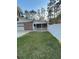 View of a screened-in porch and a white fence lining the property at 202 Woodland Dr, Summerville, SC 29485
