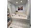 Inviting bathroom features a tiled, built-in bathtub adding a touch of comfort and relaxation at 202 Woodland Dr, Summerville, SC 29485