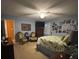Spacious bedroom featuring a TV, seating area, and a comfortable bed for relaxing and restful nights at 202 Woodland Dr, Summerville, SC 29485