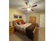Bedroom featuring a ceiling fan, a comfortable bed, and windows with plantation shutters at 202 Woodland Dr, Summerville, SC 29485