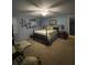 Bedroom with blue walls, ceiling fan, and a comfortable bed at 202 Woodland Dr, Summerville, SC 29485