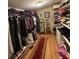Walk-in closet with shelving, hanging clothes, and a mirrored area for efficient storage and dressing at 202 Woodland Dr, Summerville, SC 29485
