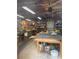 Interior view of a garage with tools and equipment on shelves and workbenches at 202 Woodland Dr, Summerville, SC 29485