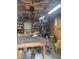 Interior view of a garage featuring a workbench, shelves, and tools at 202 Woodland Dr, Summerville, SC 29485