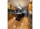 Bright kitchen featuring an island, stainless steel appliances, and hardwood floors at 202 Woodland Dr, Summerville, SC 29485