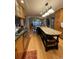Bright and open kitchen featuring a large island with seating, hardwood floors, and modern appliances at 202 Woodland Dr, Summerville, SC 29485