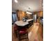 Spacious kitchen with granite countertops, stainless steel appliances, and a central island with seating at 202 Woodland Dr, Summerville, SC 29485