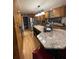 Well-lit kitchen with a large island, stainless steel appliances, and ample cabinet space at 202 Woodland Dr, Summerville, SC 29485