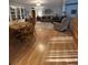 Open-concept home featuring wood floors, traditional furnishings, and a bookcase at 202 Woodland Dr, Summerville, SC 29485