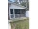 Outdoor living space featuring a screened porch and a white fence at 202 Woodland Dr, Summerville, SC 29485