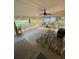Spacious screened porch featuring a grill, dining area, and ample seating at 202 Woodland Dr, Summerville, SC 29485