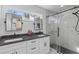 Bathroom with double vanity, granite countertop, and a sliding glass shower door at 205 Fairchild St, Daniel Island, SC 29492