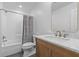 Bright bathroom with a single sink vanity, marble countertop, and shower and tub combo at 205 Fairchild St, Daniel Island, SC 29492