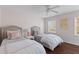 Bedroom with two beds, ceiling fan, and ample natural light at 205 Fairchild St, Daniel Island, SC 29492