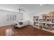 Spacious bedroom with hardwood floors, ceiling fan, and built-in shelving at 205 Fairchild St, Daniel Island, SC 29492