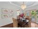 Dining room with trey ceiling, decorative wallpaper, and natural light, perfect for entertaining at 205 Fairchild St, Daniel Island, SC 29492