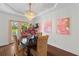 Bright dining area featuring a decorative trey ceiling, chandelier, and access to outdoor space at 205 Fairchild St, Daniel Island, SC 29492