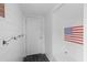 Entryway with shiplap walls, coat hooks, American flag decor and brick floor at 205 Fairchild St, Daniel Island, SC 29492