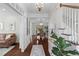 Elegant foyer with hardwood floors, wallpaper, chandelier, and staircase at 205 Fairchild St, Daniel Island, SC 29492