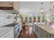 Bright kitchen boasts stainless appliances, island with sink, gas range, and eat-in breakfast area at 205 Fairchild St, Daniel Island, SC 29492
