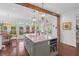 Bright kitchen features a large island with seating, a view to the yard, and modern pendant lighting at 205 Fairchild St, Daniel Island, SC 29492