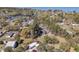 Breathtaking high shot of a house with storage outbuilding, nestled among green trees at 212 Lake Moultrie Dr, Bonneau, SC 29431