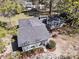 Aerial view of home highlighting roof, landscaping, and surrounding mature trees for a private feel at 212 Lake Moultrie Dr, Bonneau, SC 29431