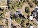 Aerial view of home and neighborhood on a clear, sunny day, showing trees and street layout at 212 Lake Moultrie Dr, Bonneau, SC 29431