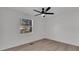 Bedroom with ceiling fan and view of backyard at 212 Lake Moultrie Dr, Bonneau, SC 29431