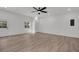 Spacious room featuring lots of natural light, laminate floors, and ceiling fan at 212 Lake Moultrie Dr, Bonneau, SC 29431